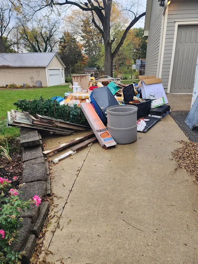 Dumpster being loaded with debris for Estate Cleanout Dumpster Rental in Fairfield